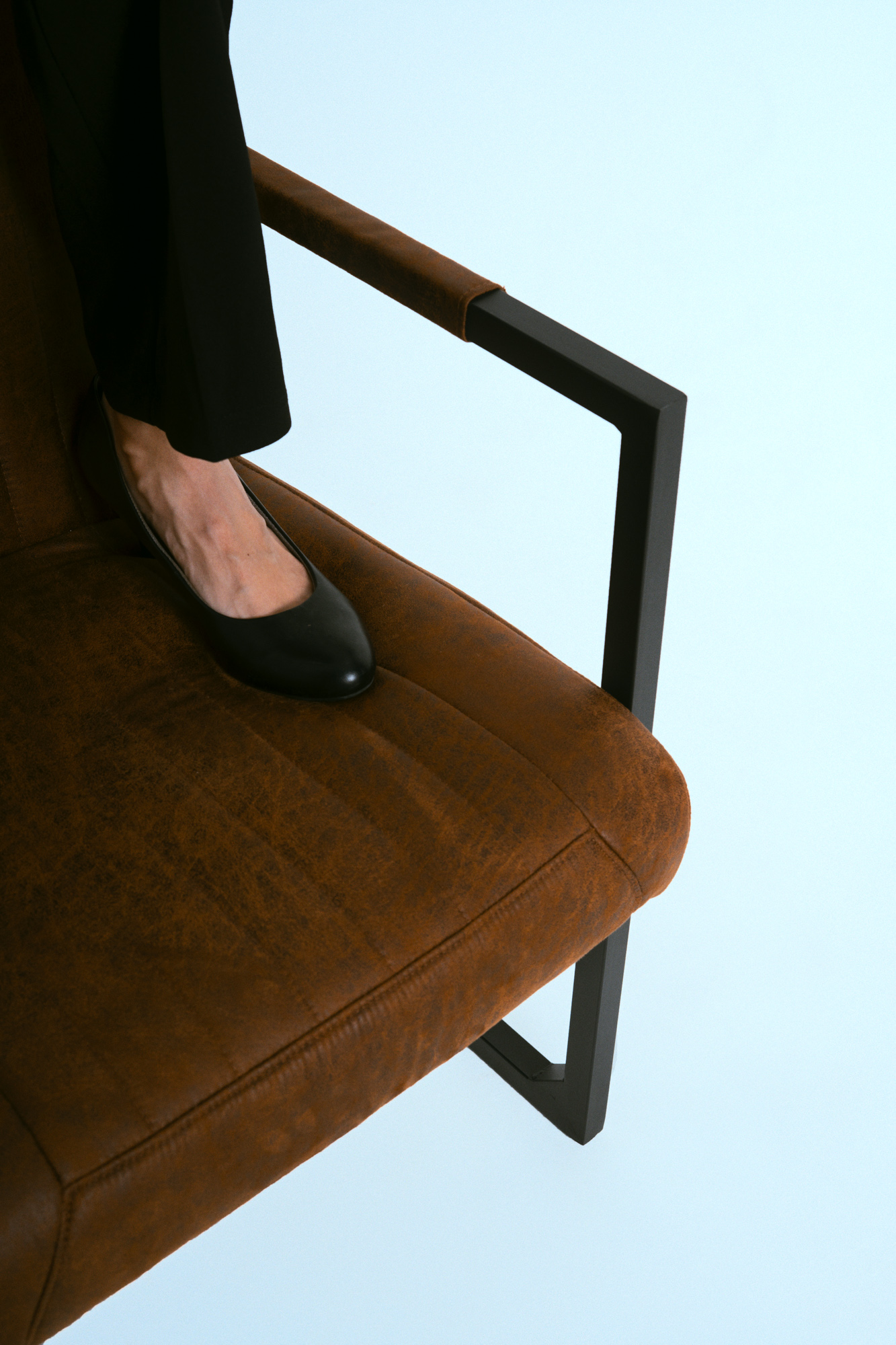 Detail shot of shoe and chair during the studio portrait session